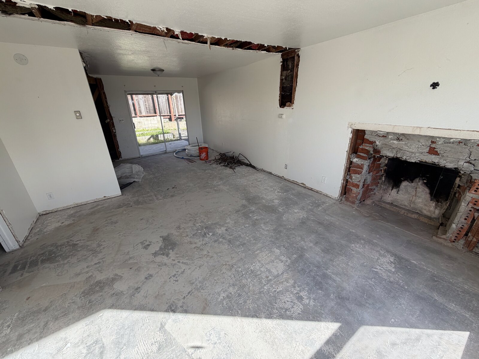 Interior demolition — exposed fireplace